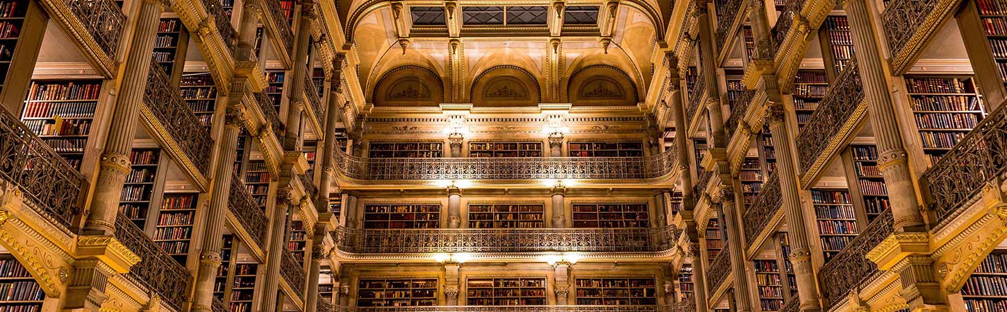 peabody library multiple floors bathed in golden light
