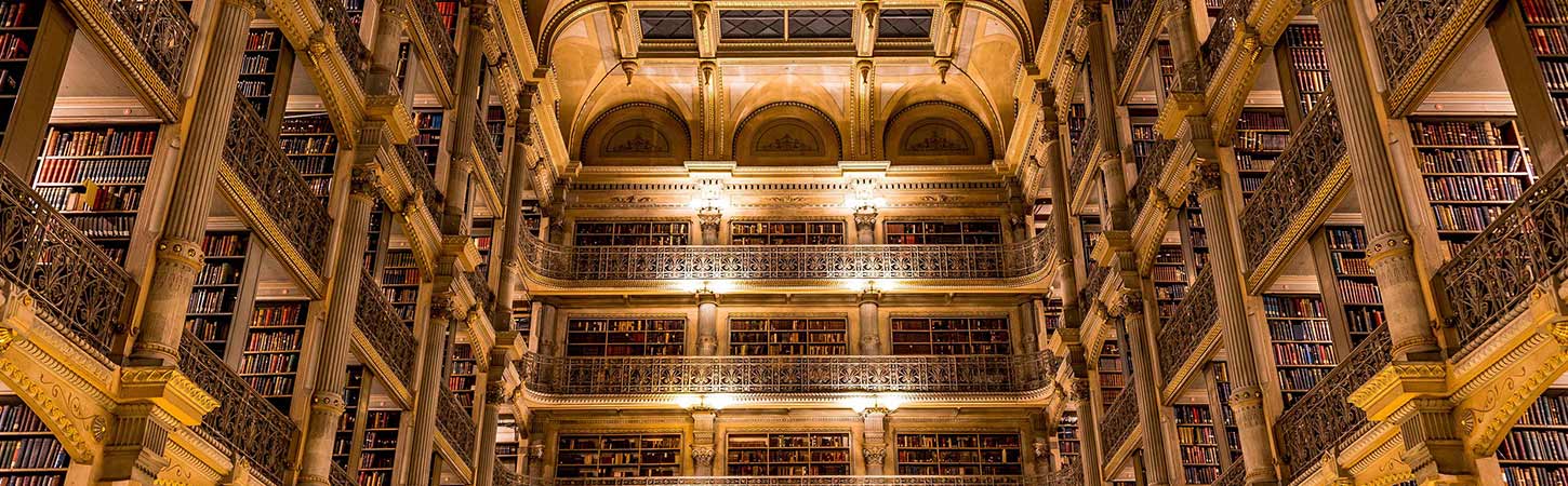 peabody library multiple floors bathed in golden light