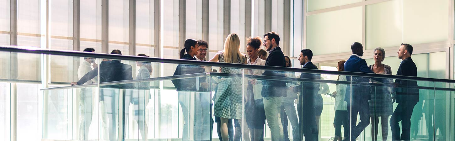 business people socializing in lobby common area