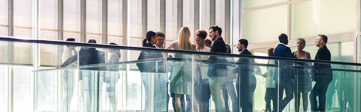 business people socializing in lobby common area