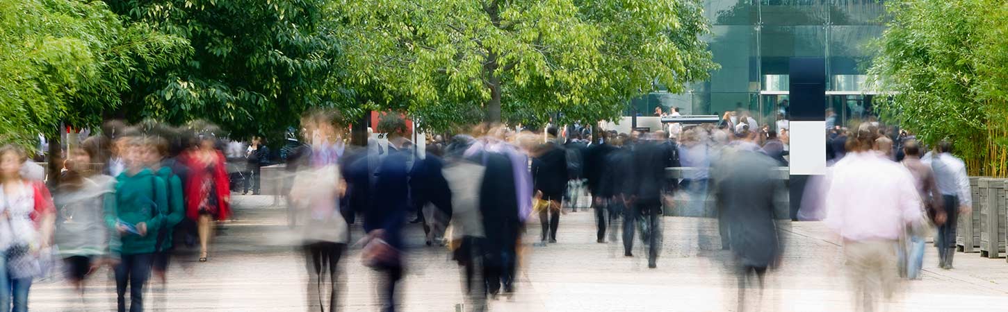 business people walking in blurred motion